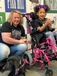 Corbynn and Remi the service dog in training to be a seizure response dog